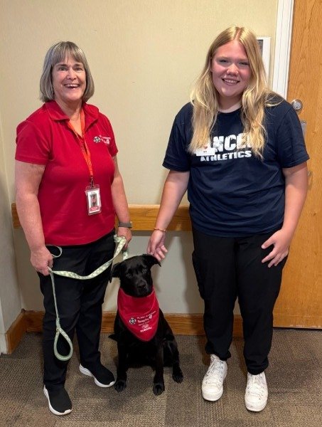 Therapy dog visits bring joy to Village on the Thames residents and staff